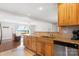 Spacious kitchen with stainless steel appliances, granite countertops, and an open layout to the lake view living area at 6294 Southlake Dr, Hickory, NC 28601