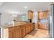 Updated kitchen with granite countertops, stainless steel appliances, tile flooring, and a view to the dining area at 6294 Southlake Dr, Hickory, NC 28601