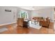 Inviting living room featuring hardwood floors, natural light, and cozy seating arrangement at 6294 Southlake Dr, Hickory, NC 28601