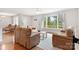 Bright living room featuring hardwood floors, comfortable seating, and a large window with scenic views at 6294 Southlake Dr, Hickory, NC 28601