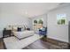Inviting bedroom boasts a large window, soft rug, and a cozy blue accent chair at 718 Lithia Inn Rd, Lincolnton, NC 28092