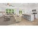 Staged living space featuring a kitchen island, comfortable seating, and ample natural light at 722 Lithia Inn Rd, Lincolnton, NC 28092
