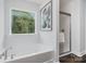 Bathroom featuring soaking tub and glass shower at 726 Lithia Inn Rd, Lincolnton, NC 28092