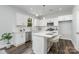 A modern kitchen with white cabinets, stainless steel appliances, and a stylish island at 726 Lithia Inn Rd, Lincolnton, NC 28092