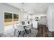Charming kitchen area features stainless steel appliances and lots of light from the sliding glass doors to the back at 726 Lithia Inn Rd, Lincolnton, NC 28092