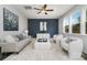 Stylish living room featuring a cozy sofa and chic decor, illuminated by natural light at 726 Lithia Inn Rd, Lincolnton, NC 28092