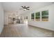 Open-concept living room featuring light wood floors and access to a modern kitchen at 726 Lithia Inn Rd, Lincolnton, NC 28092