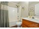 Bathroom featuring a shower and tub with updated vanity and fixtures at 7671 Bluff Point Ln, Denver, NC 28037