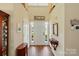 Grand foyer with hardwood floors, high ceilings, and elegant decor at 7671 Bluff Point Ln, Denver, NC 28037