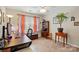 Comfortable office space with natural lighting, neutral colors, and ceiling fan at 7671 Bluff Point Ln, Denver, NC 28037