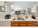 Open-concept kitchen with a stainless steel sink and view into the dining room and living room at 7671 Bluff Point Ln, Denver, NC 28037