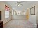 Spacious living room with neutral carpet, recessed lighting, and an open floor plan at 7671 Bluff Point Ln, Denver, NC 28037
