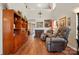 Spacious living room with hardwood floors, fireplace, and high ceilings at 7671 Bluff Point Ln, Denver, NC 28037