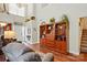 Inviting living room with high ceilings, hardwood floors and a wooden bookcase at 7671 Bluff Point Ln, Denver, NC 28037