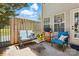 Cozy patio with charming furniture, a grill, and a privacy fence, ideal for outdoor gatherings at 7671 Bluff Point Ln, Denver, NC 28037