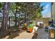 Cozy patio area with potted plants, seating, and privacy fence, perfect for outdoor relaxation and entertaining at 7671 Bluff Point Ln, Denver, NC 28037