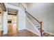 Bright entryway featuring hardwood floors, a staircase with dark metal balusters, and access to the living room at 770 Highway 274 Rd, Clover, SC 29710
