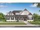 Charming two-story home with a covered front porch, black shutters, and lush landscaping at 770 Highway 274 Rd, Clover, SC 29710