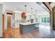 Modern kitchen with a large island, stainless steel appliances, pendant lighting and hardwood flooring at 770 Highway 274 Rd, Clover, SC 29710