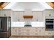 Modern kitchen with white cabinets, stainless appliances, gas range, and lots of storage space at 770 Highway 274 Rd, Clover, SC 29710