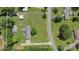 Aerial view of the property highlighting the home, driveway, and surrounding greenery at 7869 Cherry Point Dr, Denver, NC 28037