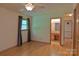 Bright bedroom features hardwood floors, neutral walls and en-suite bathroom at 7869 Cherry Point Dr, Denver, NC 28037