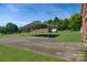 Exterior view of a carport and barn on the property, perfect for storage and vehicle coverage at 7869 Cherry Point Dr, Denver, NC 28037