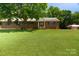 Charming brick ranch on sprawling lawn with a barn; a serene country living opportunity at 7869 Cherry Point Dr, Denver, NC 28037