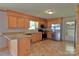 A kitchen featuring stainless steel appliances, a breakfast bar and wooden cabinets at 7869 Cherry Point Dr, Denver, NC 28037