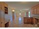 Spacious kitchen open to living area features wooden cabinetry and granite countertops at 7869 Cherry Point Dr, Denver, NC 28037