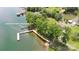 Aerial view of property with lake access, featuring a boat ramp and picnic area for outdoor enjoyment at 7869 Cherry Point Dr, Denver, NC 28037