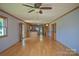 Open-concept living area features hardwood floors and seamlessly connects to the kitchen at 7869 Cherry Point Dr, Denver, NC 28037