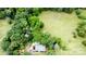 Expansive estate featuring a home nestled amongst mature trees and a spacious manicured lawn at 8340 Brief Rd, Mint Hill, NC 28227