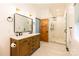 Beautiful bathroom featuring double vanity with wood cabinets and a glass shower at 8340 Brief Rd, Mint Hill, NC 28227