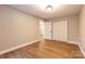 This bedroom features hardwood floors and a closet with doors for storage at 8340 Brief Rd, Mint Hill, NC 28227