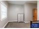 Bedroom with dresser, carpet, and a small window at 8340 Brief Rd, Mint Hill, NC 28227