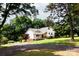 Lovely home with a welcoming front porch situated on a private, tree-lined lot at 8340 Brief Rd, Mint Hill, NC 28227