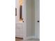 Hallway view featuring a vanity with wood accent wall and a doorway leading to another room at 8340 Brief Rd, Mint Hill, NC 28227