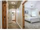 Hallway view with access to a bathroom and the main bedroom, both showing natural light at 8340 Brief Rd, Mint Hill, NC 28227