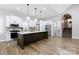 Bright kitchen featuring a large island, stainless steel appliances, and ample cabinet space at 8340 Brief Rd, Mint Hill, NC 28227