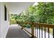 Relaxing porch with wood railing overlooks the tree-lined backyard at 8340 Brief Rd, Mint Hill, NC 28227