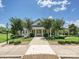 Stately clubhouse with symmetrical design, featuring manicured landscaping and a welcoming entrance at 9405 Gladden Hill Ln, Pineville, NC 28134