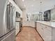 Modern kitchen with stainless steel appliances and granite countertops, open to the living space at 9405 Gladden Hill Ln, Pineville, NC 28134
