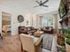 Warm living room with leather furniture, fireplace, and hardwood floors, next to the main bedroom at 9405 Gladden Hill Ln, Pineville, NC 28134