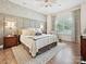 Serene main bedroom with decorative wallpaper and a large window at 9405 Gladden Hill Ln, Pineville, NC 28134