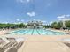 Community swimming pool featuring plenty of lounge chairs and a shaded pavilion for residents at 9405 Gladden Hill Ln, Pineville, NC 28134