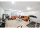 Basement living area with plush couches, neutral paint, and a treadmill at 9525 Festival Way, Charlotte, NC 28215