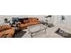 Basement living space complete with comfortable seating and workout equipment at 9525 Festival Way, Charlotte, NC 28215