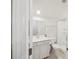 Bright bathroom featuring a shower, white vanity, white toilet, and neutral colored floor at 9525 Festival Way, Charlotte, NC 28215