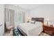 Bedroom featuring two large windows, a decorative headboard, and two ambient lamps at 9525 Festival Way, Charlotte, NC 28215